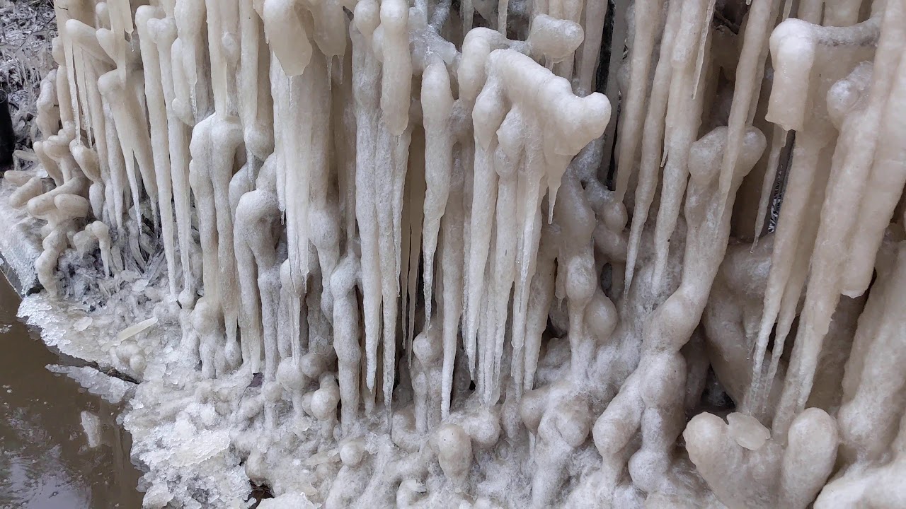 Icicles formation on the side of a road - YouTube