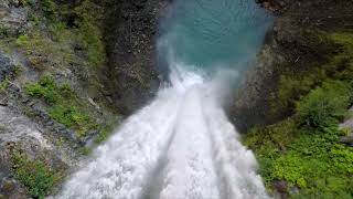 Stream Flowing Off Cliff Face Into Small Pool At Bottom Of Cliff | Free Stock Video Footage 4K