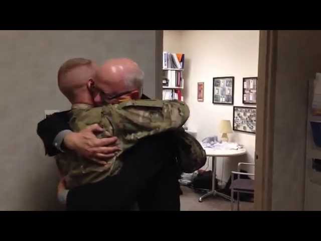Dad breaks down when son returns home early from Afghanistan class=