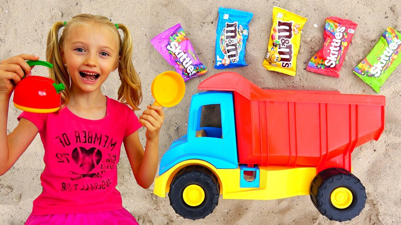 Polina playing with sand mold toys