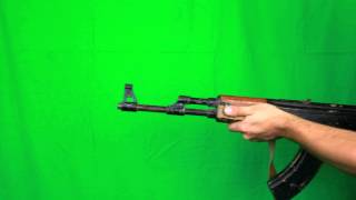 man turns around and shoots with ak-47 - HD green screen footage