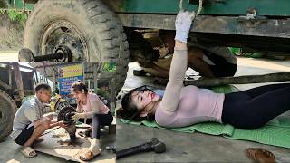 Talented female mechanic repairing and replacing tractor steering knuckle bearings.