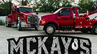 Mckays wrecker lifting a trailer