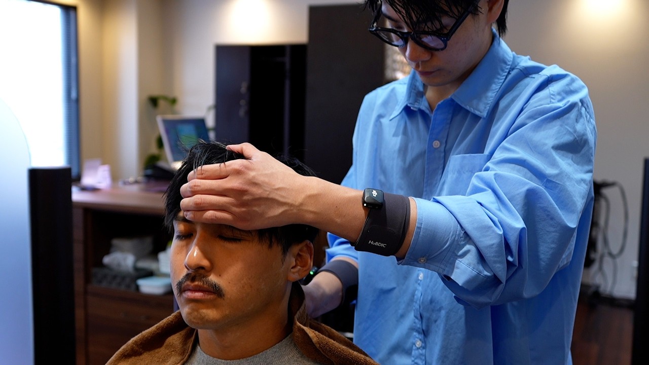Experience blissful relaxation with a young barber at Hair Clinic Calme, a barbershop in Nippori