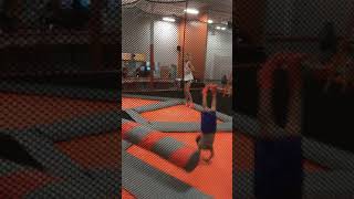 Little boy gets hit by swinging are ride then falls forward and lands in scorpion position