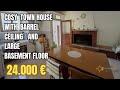 Cozy one-bedroom town house with a large basement convertible into additional living space. Palmoli