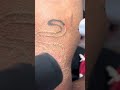 Laser tattoo removal on black Panther tattoo
