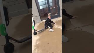 Girl on electric scooter jumps 3 stairs and lands on back of head