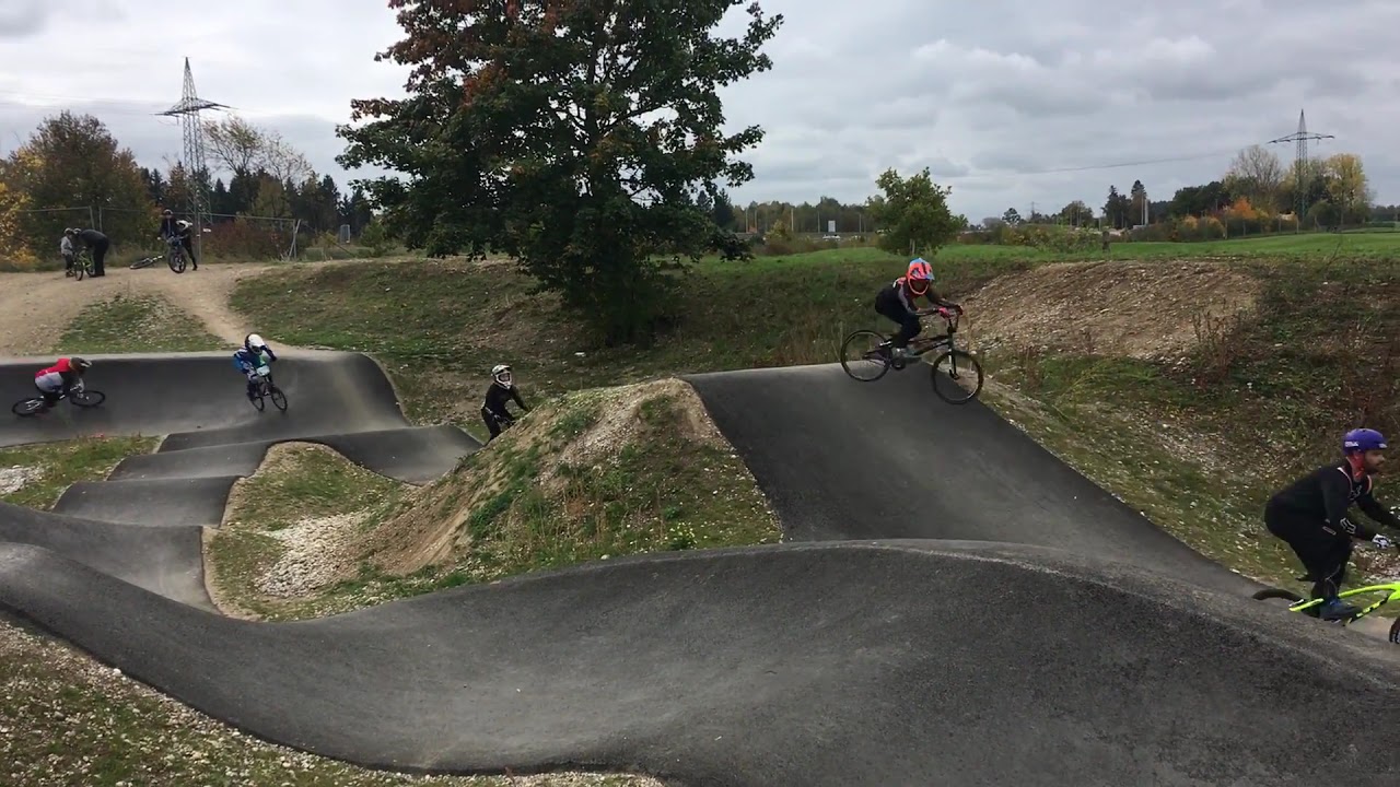 BMX-train: Riders on a pumptrack in Germering near munich having a lot of fun.