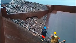 Barge unloading large size cobblestone in the rain - Relaxing videos