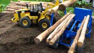 CAT 966 Loading Logs.wmv