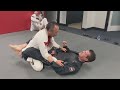 Jean jacques machado rolling with black belt student