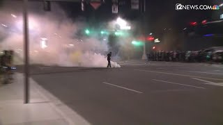 Phoenix protestors throw tear gas canisters back at police