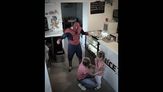 The man at the bakery makes the little girl happy