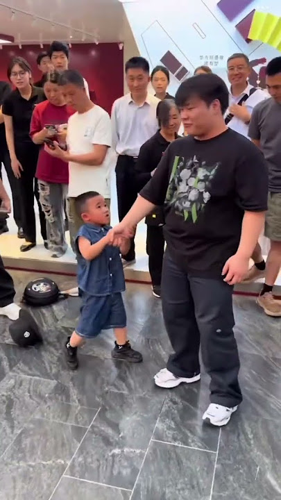 The boy dances with the robot #dance #cute