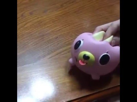 pink dog toy that sticks tongue out