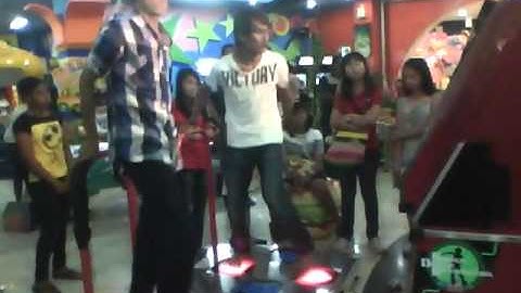 Guy plays Dance Dance Revolution blindfolded.