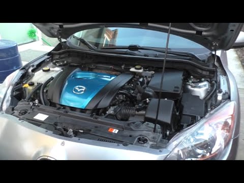 Video: Hvor mye koster det å bytte støt og fjærbein på en Mazda 3?