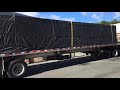 Tarping on the flatbed truck