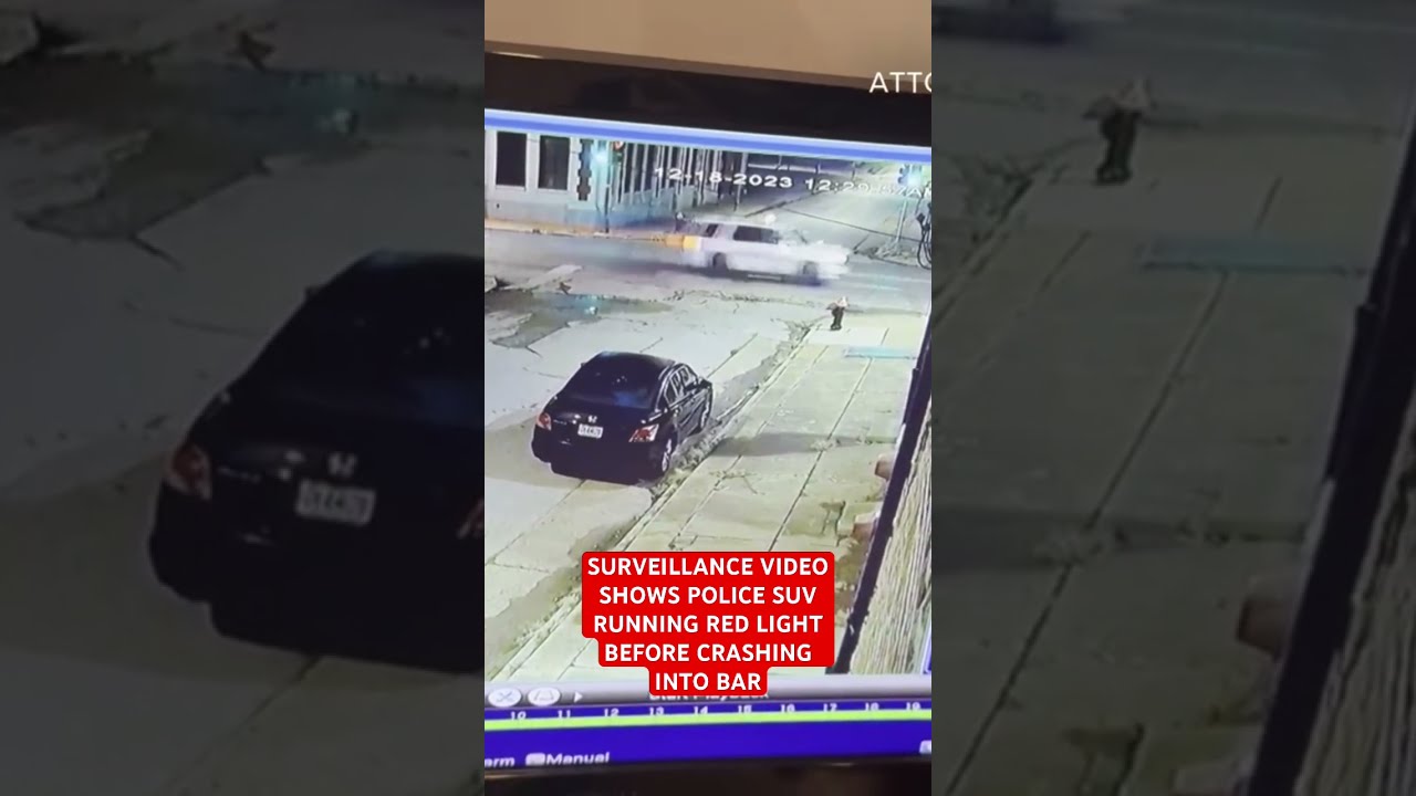 Surveillance Video Shows Police SUV Running Red Light Before Crashing Into Bar