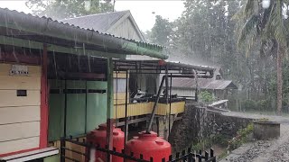 Heavy rain in rural Indonesia green village drenched in rain
