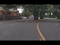 [Dashcam] Cyclist on sidewalk almost hit by car pulling out of parking lot.
