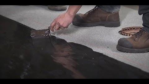 How to install an adhesive bonded cap sheet membrane on the field surface?