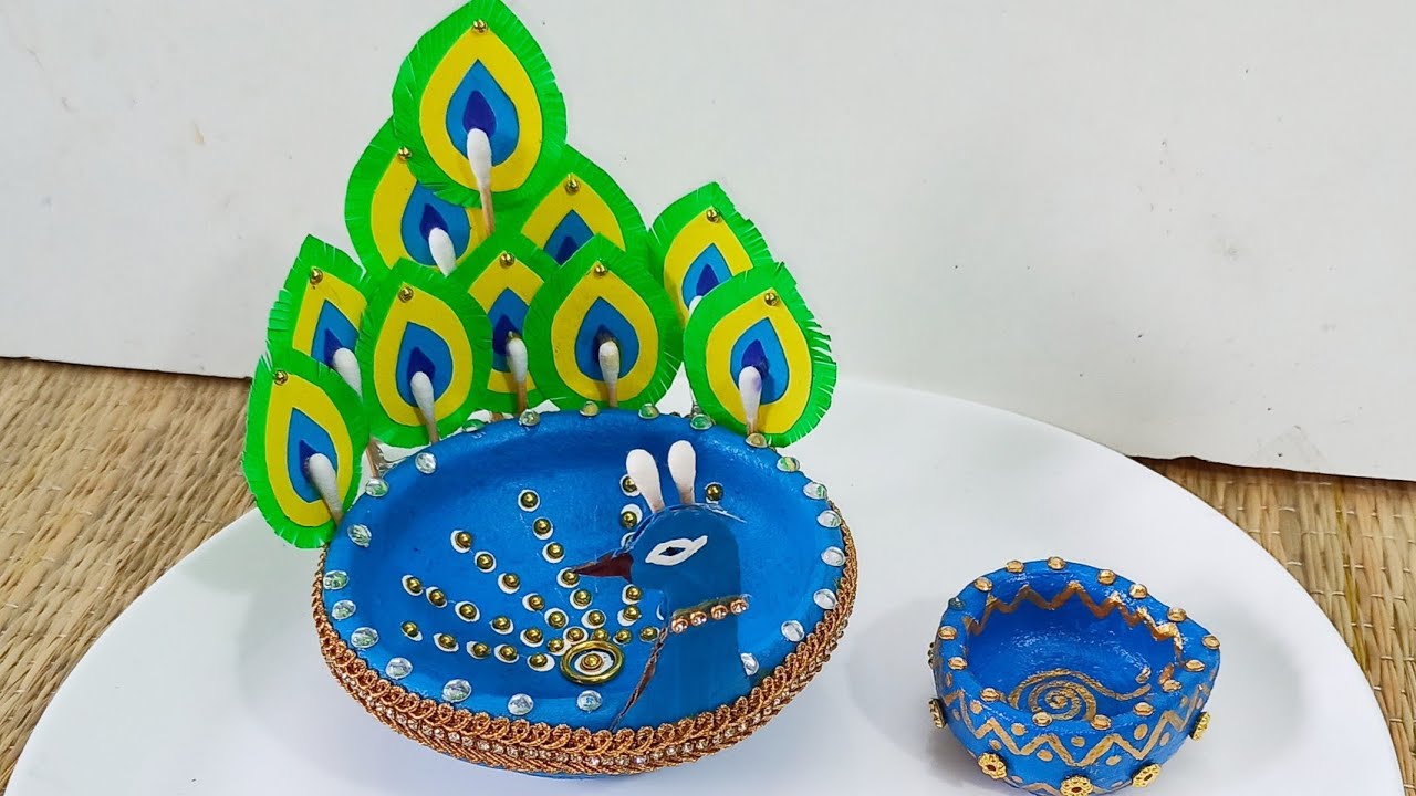 Very Beautiful Diya decoration ideas. Peacock feather diya. Very simple DIY diya decoration ideas.