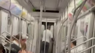 Bloodied woman records serial subway slasher walking out of train car | NBC New York