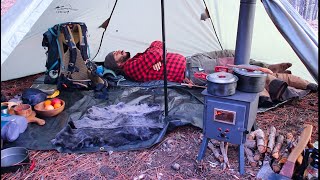 HOT TENT CAMP WITH STOVE IN RAIN AND SNOW STORM