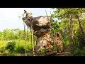 Building stairs around high rock  in the Jungle