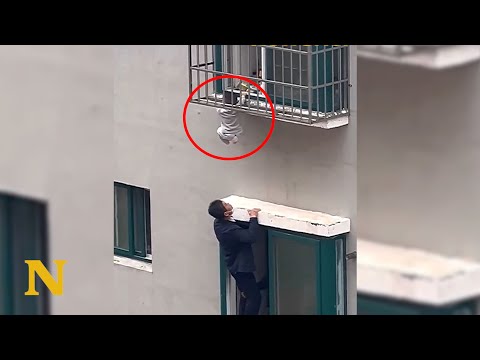 Heroes climbs out the window to save a toddler dangling from 4th-floor