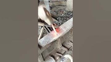 The blacksmith is making a chisel.