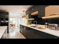 Modern Sleek Kitchen With Quartz Countertops, Stainless Appliances And Dining Area In Bright Open Pl