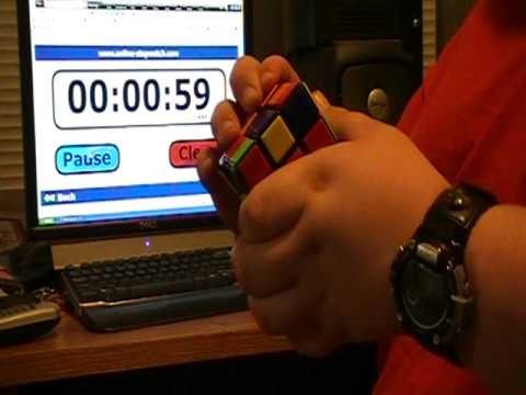 Zach solves his Rubik's cube in less than 2 min.