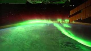 aurora borealis (or the northern lights) from orbit