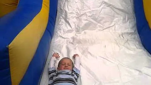 Jonathan Milstein - boys on the bounce house slide