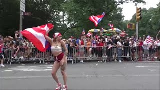 PUERTO RICAN GIRL PARADES WITH PUERTO RICAN FLAG AT PUERTO RICAN DAY PARADE NEW YORK CITY 2023 NYC 