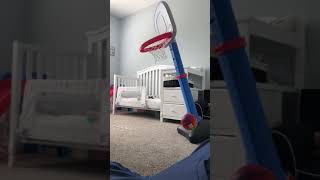 Boy dunks basketball on Little Tikes basketball court and hoops falls on his head