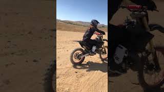 Woman riding dirt bike for the first time crashes into tire of pickup truck