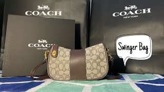 REVIEW COACH SWINGER BAG