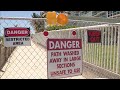 Public pathway blocked by "Danger" signs put up by beachside condo