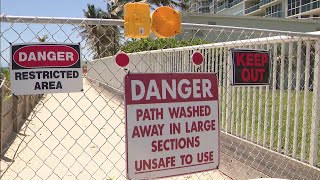 Public pathway blocked by "Danger" signs put up by beachside condo