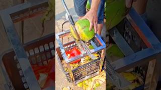 cutting coconut with sharp tool opening shell to access fresh water and soft flesh inside easily
