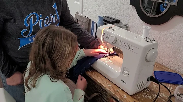 Ella learning to sew