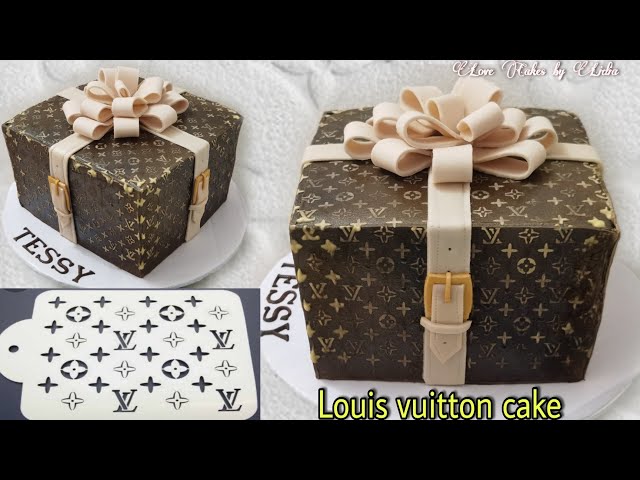 Louis Vuitton Hand Bag Sitting On Louis Vuitton Box Cake