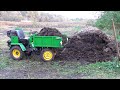 Мини Т-16 удобряет почву навозом./Mini T-16 fertilizes the soil with manure.