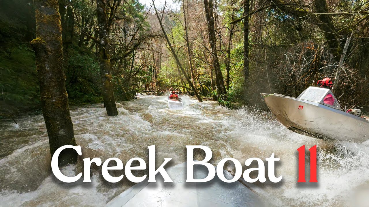 Creek Boat 11: a mini jet boat charging up a flooded creek