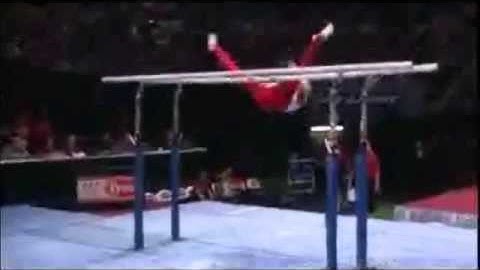 Parallel Bars Glide Kip Through Straddle Press to Handstand on One Rail Gymnastics Video