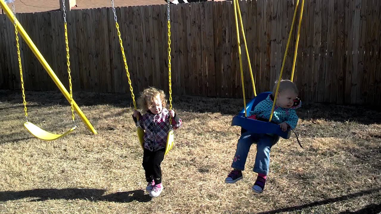 Girls swinging in their swingset that Daddy made - YouTube